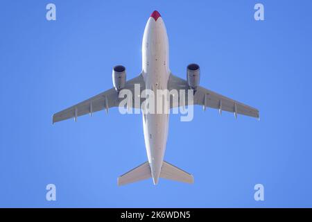 Large military transport plane flying low in a military parade of the armed forces. Stock Photo