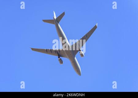 Large military transport plane flying low in a military parade of the armed forces. Stock Photo