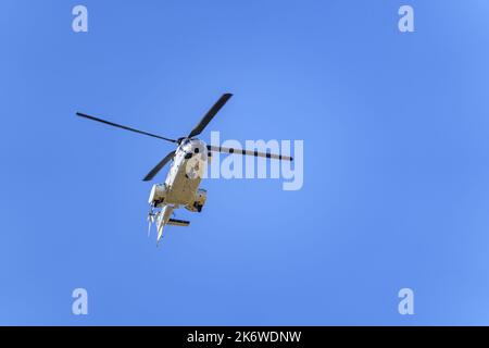 Large transport helicopter flying low in an air show of the air forces. Stock Photo