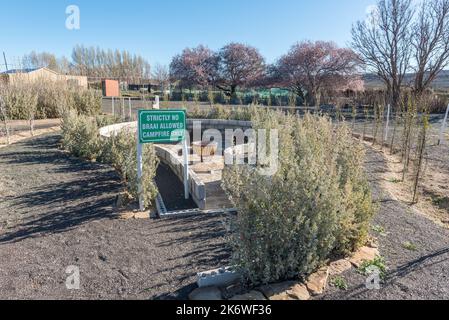 SUTHERLAND, SOUTH AFRICA - SEP 3, 2022: Fire pit at Sterland Caravan Park in Sutherland in the Northern Cape Province Stock Photo