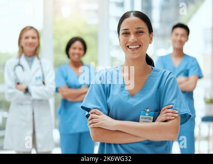 We can be good together. a group of medical practitioners standing together in a hospital. Stock Photo