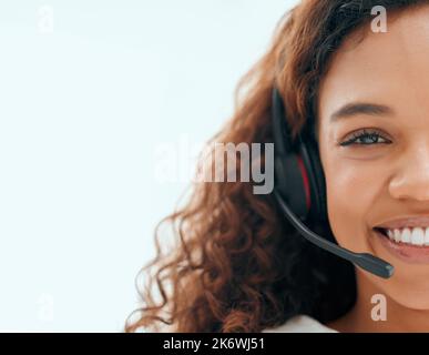 Every problem has a solution. Cropped portrait of an attractive young female call center agent working in the office. Stock Photo