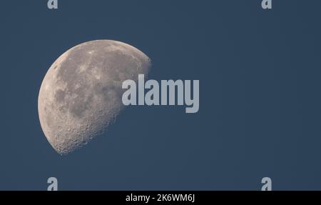 Waning Gibbous Moon in the morning sky on 16 October 2022, directly overhead London, UK Stock Photo