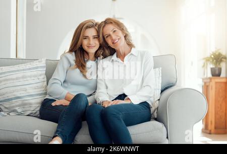 My mother is my best friend. a mother and daughter bonding on the couch together at home. Stock Photo
