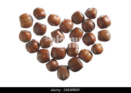 Hazelnuts in shape of heart isolated on a white background, top view Stock Photo