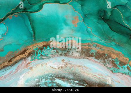 Green gold abstract background of marble liquid ink art painting on paper. Image of original artwork watercolor alcohol ink paint on high quality Stock Photo