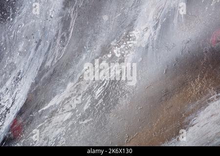 Abstract grey art with gold - black and white background with beautiful smudges and stains made with alcohol ink and golden paint. Grey fluid texture Stock Photo