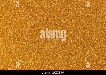 Shiny gold glitter background, new texture for elegant style. Sparkling lights festive background with texture. Abstract Christmas twinkled bright Stock Photo