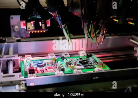 Flying probe test at factory - quality testing of printed circuit boards Stock Photo