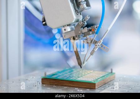 Process of selective soldering components to printed circuit boards at factory Stock Photo