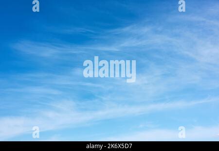 Blue sky with fleecy clouds  - vertical background with space for your own text Stock Photo