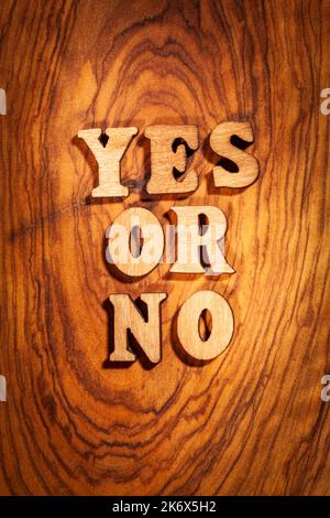 Yes or No - Words on wood close up Stock Photo