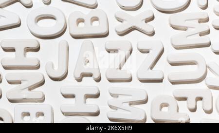 Jazz word surrounded by random white moulded letters. Inscription close up Stock Photo