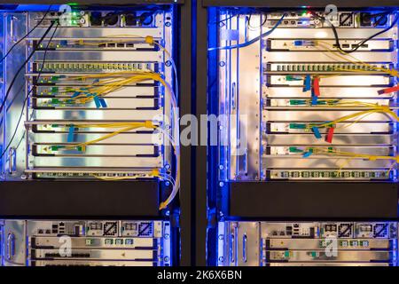 Telecommunication technology equipment - fiber optic cables and switch Stock Photo