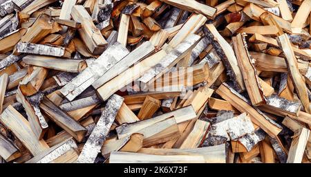 Pile of chopped firewood of Birch background Stock Photo