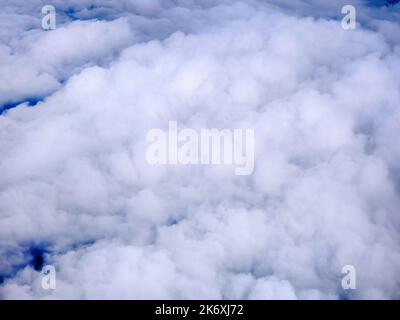 Aerial view of tranquil cloudscape in the blue sky with landscape ground below, nature wallpaper Stock Photo