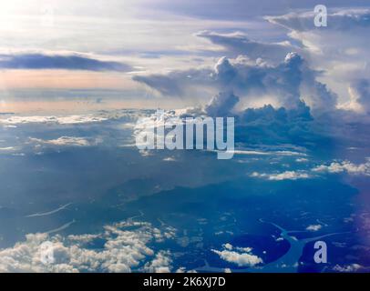 Aerial view of tranquil cloudscape in the blue sky with landscape ground below, nature wallpaper Stock Photo