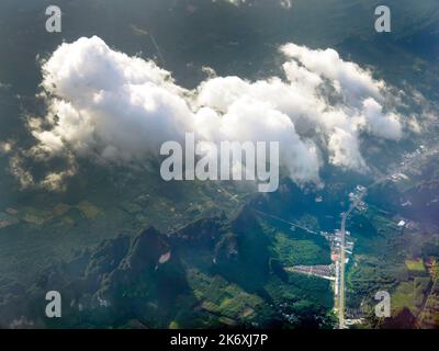 Aerial view of tranquil cloudscape in the blue sky with landscape ground below, nature wallpaper Stock Photo