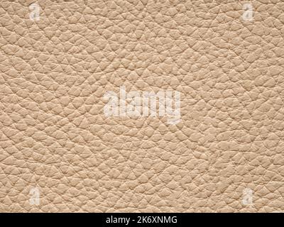 Beige leather texture. Light artificial leather with waves and folds on PVC base. Can use as wallpaper or backdrop luxury event, design clothes Stock Photo