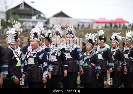 A Chinese villager of Miao ethnic group wearing traditional costumes  practises ''Miao stickfighting'', a unique martial art of the Miao Martial  Arts i Stock Photo - Alamy