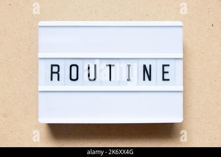 Lightbox with word routine on wood background Stock Photo