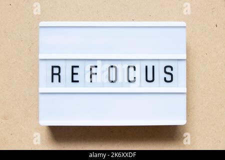 Lightbox with word refocus on wood background Stock Photo