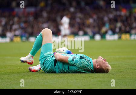 Arsenal goalkeeper Aaron Ramsdale reacts after being struck by the ball during the Premier League match at Elland Road, Leeds. Picture date: Sunday October 16, 2022. Stock Photo