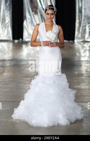 A model walks for designer 'Bodied by Jojo' at New York Fashion Week The Society at the Hall of Mirrors. Classic Bridal Gown. Stock Photo