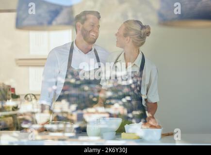 Everything is fun when we do it together. a young couple cooking together at home. Stock Photo