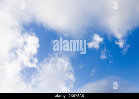 Soft blue sky with white clouds, pastel background Stock Photo