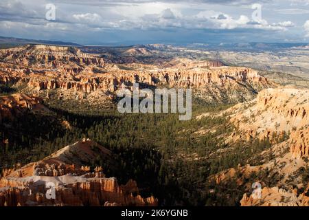 Bryce Canyon - red spiky rocks in Bryce canyon in Utah. Bryce canyon amphitheater overlook with fascinating red and orange rocks in the golden hour Stock Photo