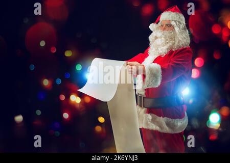 Santa Claus is full of presents request to delivery Stock Photo