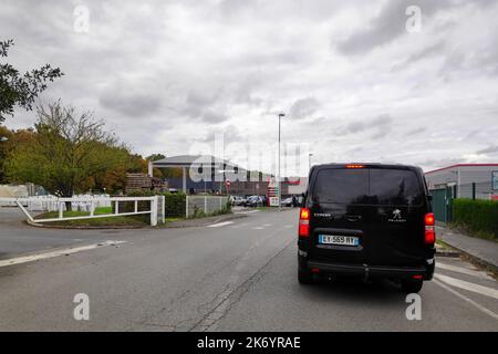 Lamorlaye, France - October 16 2022: Cars waiting in line to filled their tanks under the supervision of the Gendarmerie at a gas station due to fuel Stock Photo