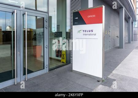 The offices of Telus International, Point Village, Dublin, Ireland. a provider of Multilingual Customer Experience & Technical Support solutions. Stock Photo