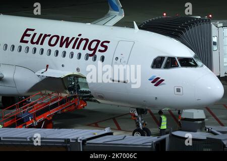 Hamburg, Germany. 16th Oct, 2022. An aircraft of the airline Eurowings is parked at Hamburg Airport in the evening. The Vereinigung Cockpit union has called on Eurowings pilots to stop working from 00:00 on Monday 17 October until Wednesday 19 October inclusive. Credit: Bodo Marks/Bodo Marks/dpa/Alamy Live News Stock Photo