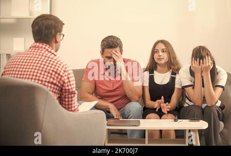 parents with kid talk to social worker. mom dad and daughter. life insurance and adoption Stock Photo