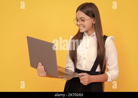 cheerful child study online. computer vision syndrome. nerd typing school blog. Stock Photo