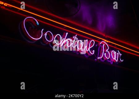 Purple neon cocktail bar sign Stock Photo