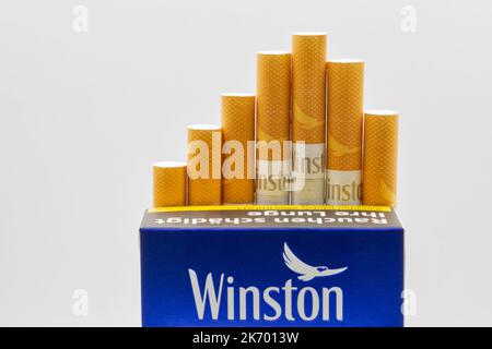 winston cigarettes gold box Kyiv, Ukraine - September 03, 2022: A pack of Winston Blue cigarettes  closeup on white. It is an American brand of cigarettes, currently owned  and man Stock Photo
