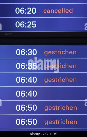 Hamburg, Germany. 16th Oct, 2022. Flight cancellations are announced on display boards at Hamburg Airport this evening. The Vereinigung Cockpit (VC) union has called on Eurowings pilots to stop working from 00:00 on Monday 17 October until Wednesday 19 October. Credit: Bodo Marks/Bodo Marks/dpa/Alamy Live News Stock Photo