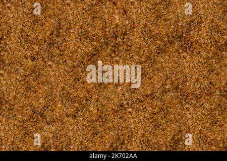 High angle full-frame photo of brown sugar grains making pattern for background, wallpaper Stock Photo