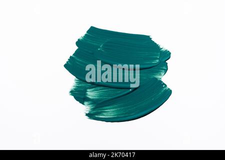 Dark teal paint smear on white background. Macro shot. Trendy color of 2023 and 2024 Stock Photo