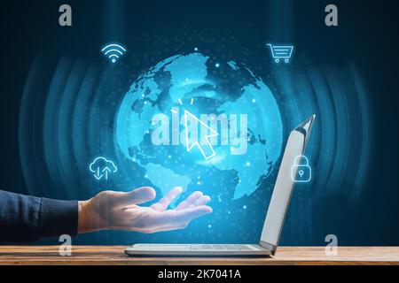The concept of technological globalization. Services in the global Internet. Person hand over laptop with hologram Stock Photo