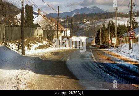 Bran, Brasov County, Romania, approx. 1999. Main road after a snow storm. Stock Photo