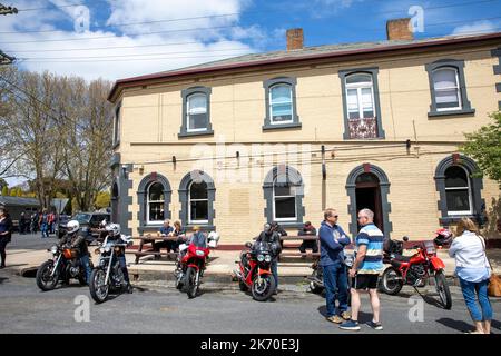 Orange motorcycle club for classic and cafe racer bikes assemble in Millthorpe village, a heritage town village, New South Wales,Australia,spring day Stock Photo