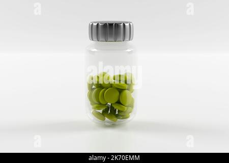 Plastic bottles filled with green pills on white background. Stock Photo