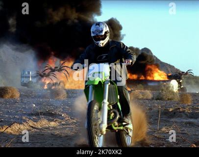 SPIDERS CHASE MOTORCYCLIST, EIGHT LEGGED FREAKS, 2002 Stock Photo