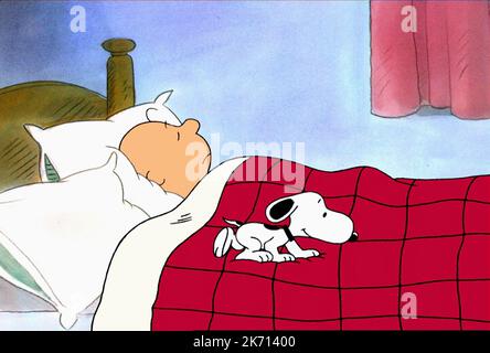snoopy laying in bed