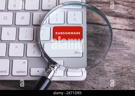 Business concept: RANSOMWARE on computer keyboard on wooden background with copyspace area Stock Photo