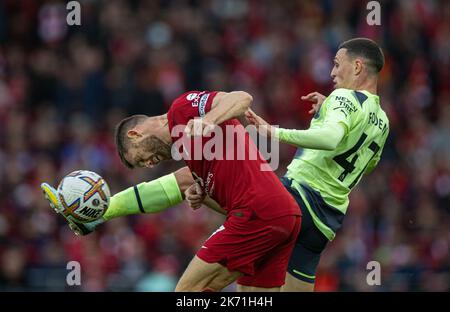 Liverpool. 17th Oct, 2022. Liverpool's James Milner (L) is challenged by Manchester City's Phil Foden during the English Premier League match between Liverpool and Manchester City in Liverpool, Britain, Oct. 16, 2022. Credit: Xinhua/Alamy Live News Stock Photo